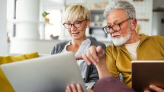 mature-couple-checking-investments